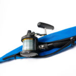 A blue bag with a fishing reel in it.