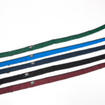 Four different colored straps on a white background.